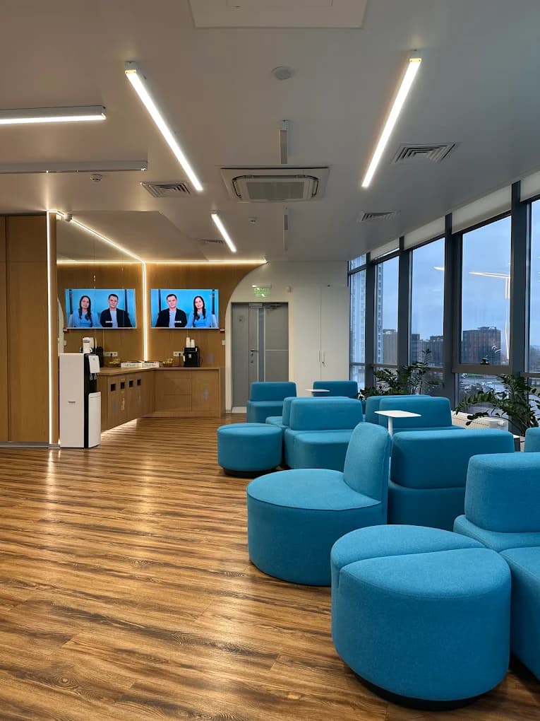 Client lounge with information screens and comfortable seating