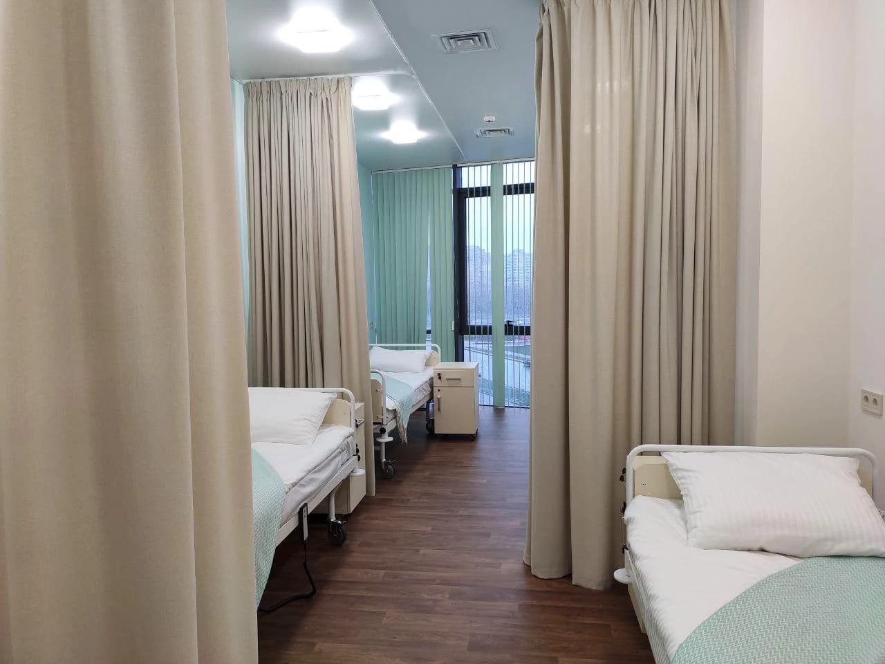 Private recovery room with adjustable beds, clean linens and natural light